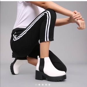 Chunky white and black ankle booties